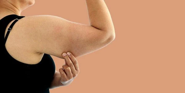 Toning Bingo Wings: Your Ultimate Guide to Sculpting Sleek Arms at the Gym 1 Woman doing push-ups for arm strength Eccles