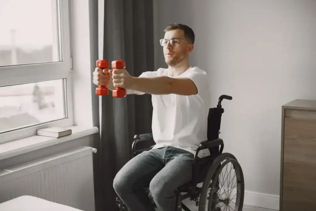 Image of man doing exercise in his wheelchair to aid weight loss Eccles