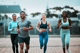 Sculpting Sleek Arms: The Essential Role of Cardio in Toning Without Bulking Up 3 image of people running to incorporate cardio Eccles exercise into their life to help tone arms and body.
